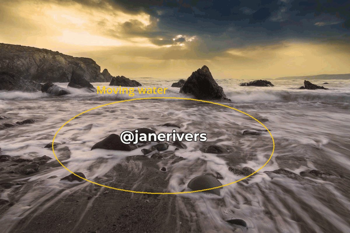 A GIF frame of waves washing over rocks with a watermark placed in the middle of the moving water