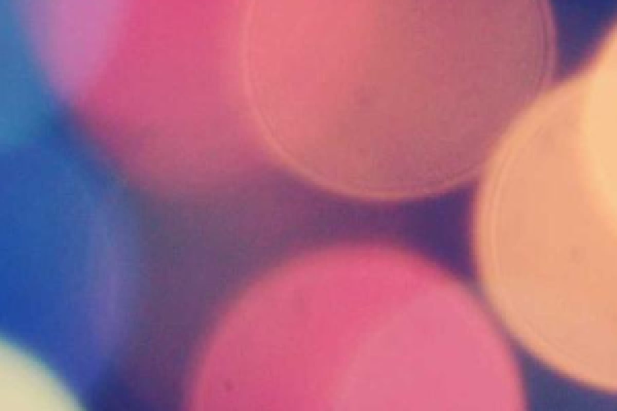 An enlarged patch of colorful out-of-focus lights with smooth gradients