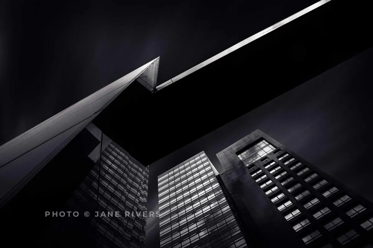 The same building photo with a soft gray credit