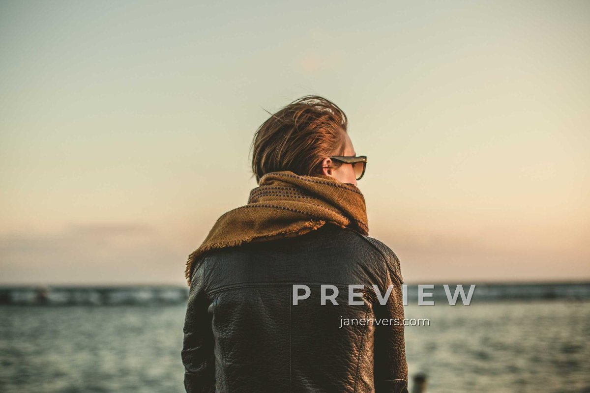 A portrait of a woman looking out to sea with a PREVIEW and janerivers.com mark in the lower right