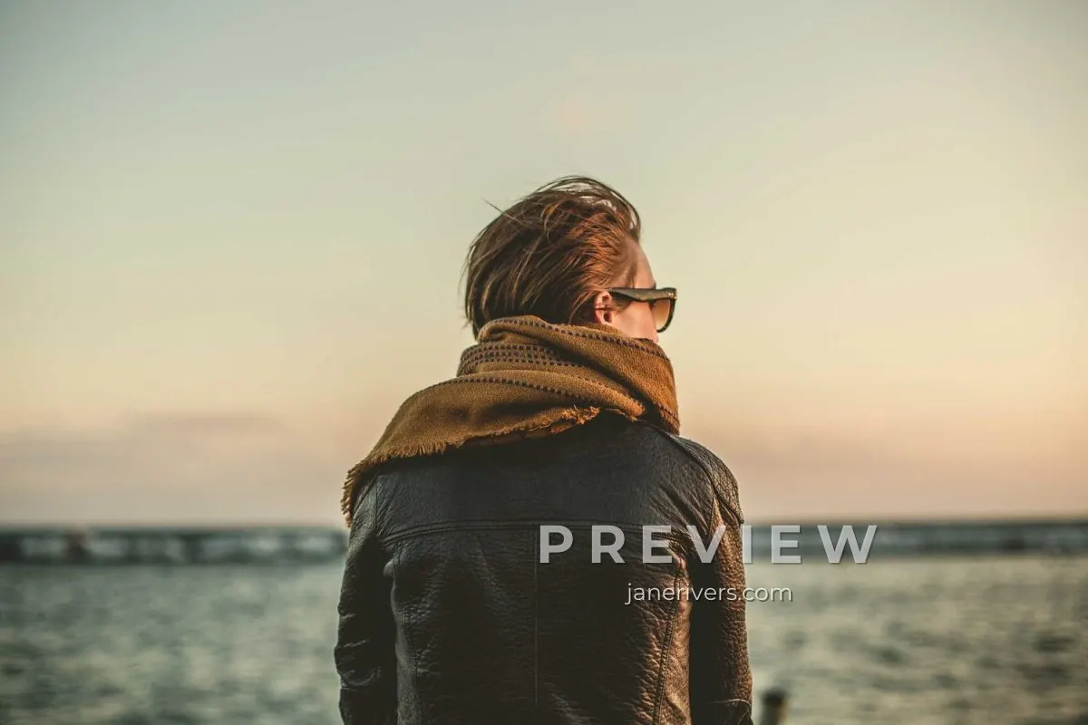 A portrait of a woman looking out to sea with a PREVIEW and janerivers.com mark in the lower right