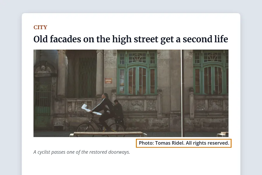 A news article layout with a photo of a cyclist passing an old building and the credit line Photo: Tomas Ridel. All rights reserved highlighted under the photo