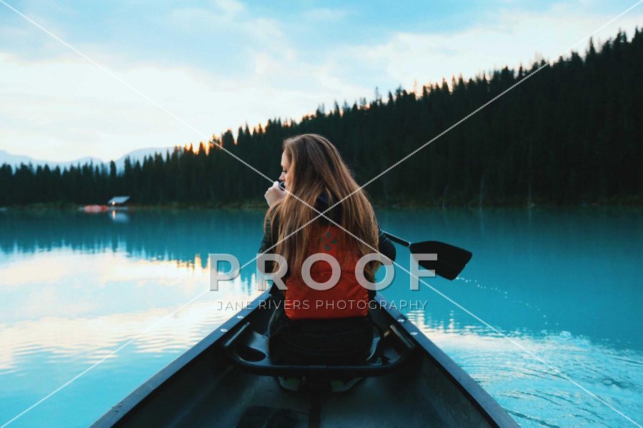 The canoe photo with a PROOF mark in the middle and two thin diagonal lines crossing the frame