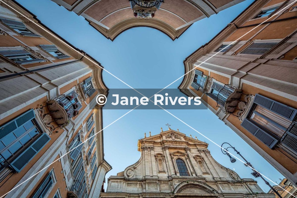 The same buildings with two thin lines crossing from corner to corner and a small horizontal watermark in the center