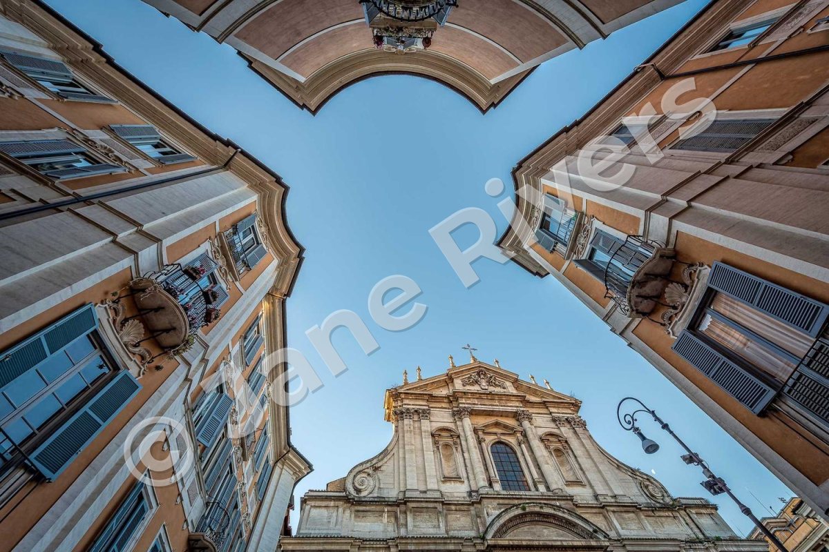 Buildings seen from below with one large semi-transparent watermark from corner to corner