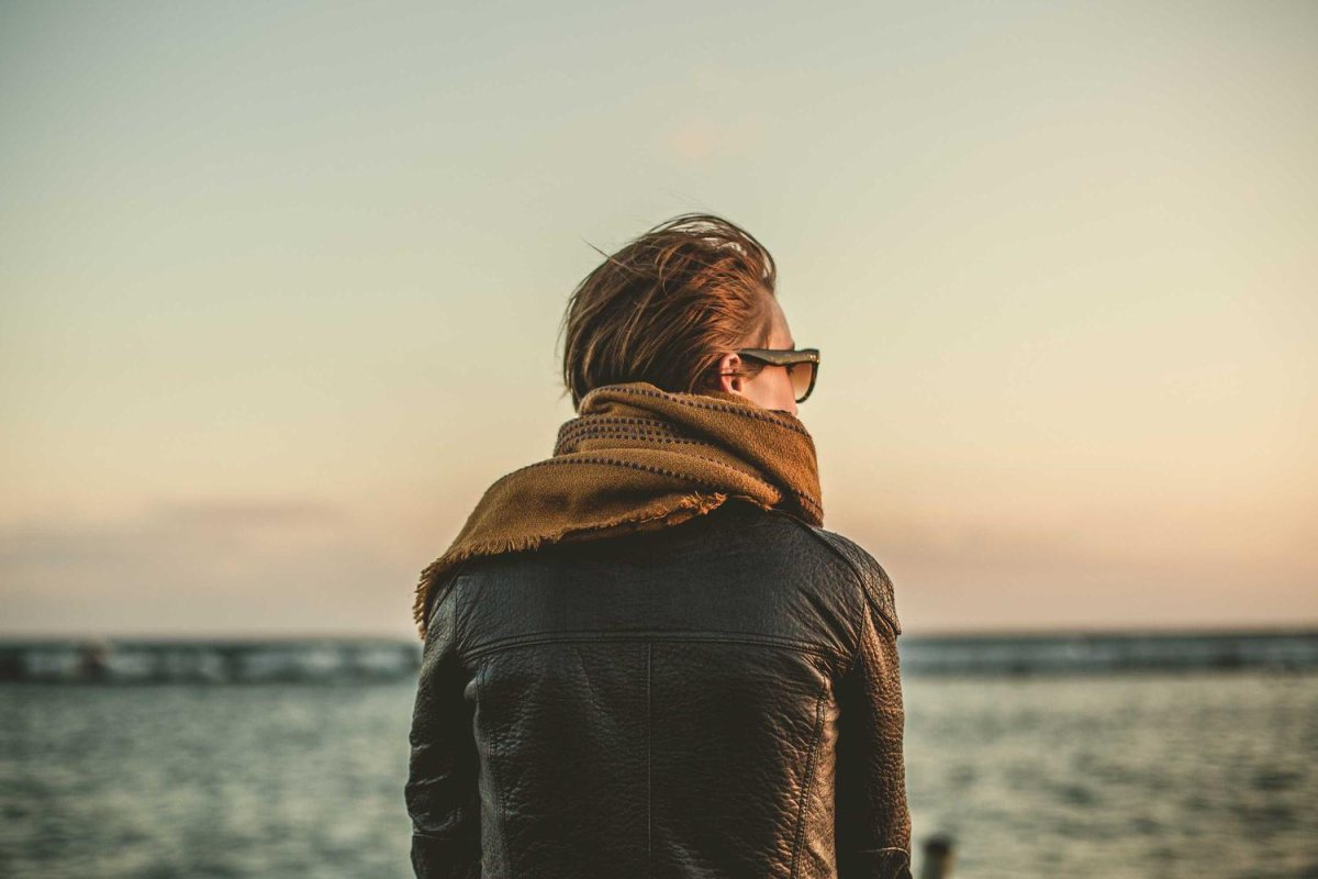 A portrait of a woman looking out to sea with no watermark