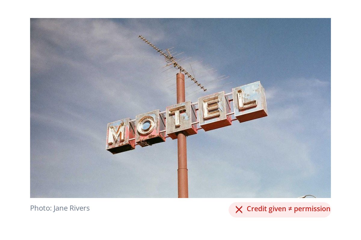 A photo of a vintage motel sign with a photo credit underneath and a red label reading Credit given does not equal permission