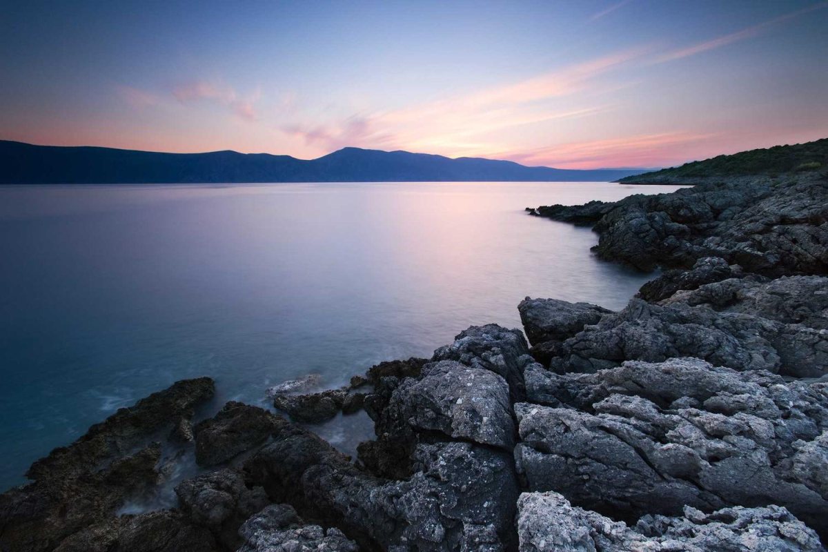 A rocky coastline at dusk with no watermark, ready for a contest entry