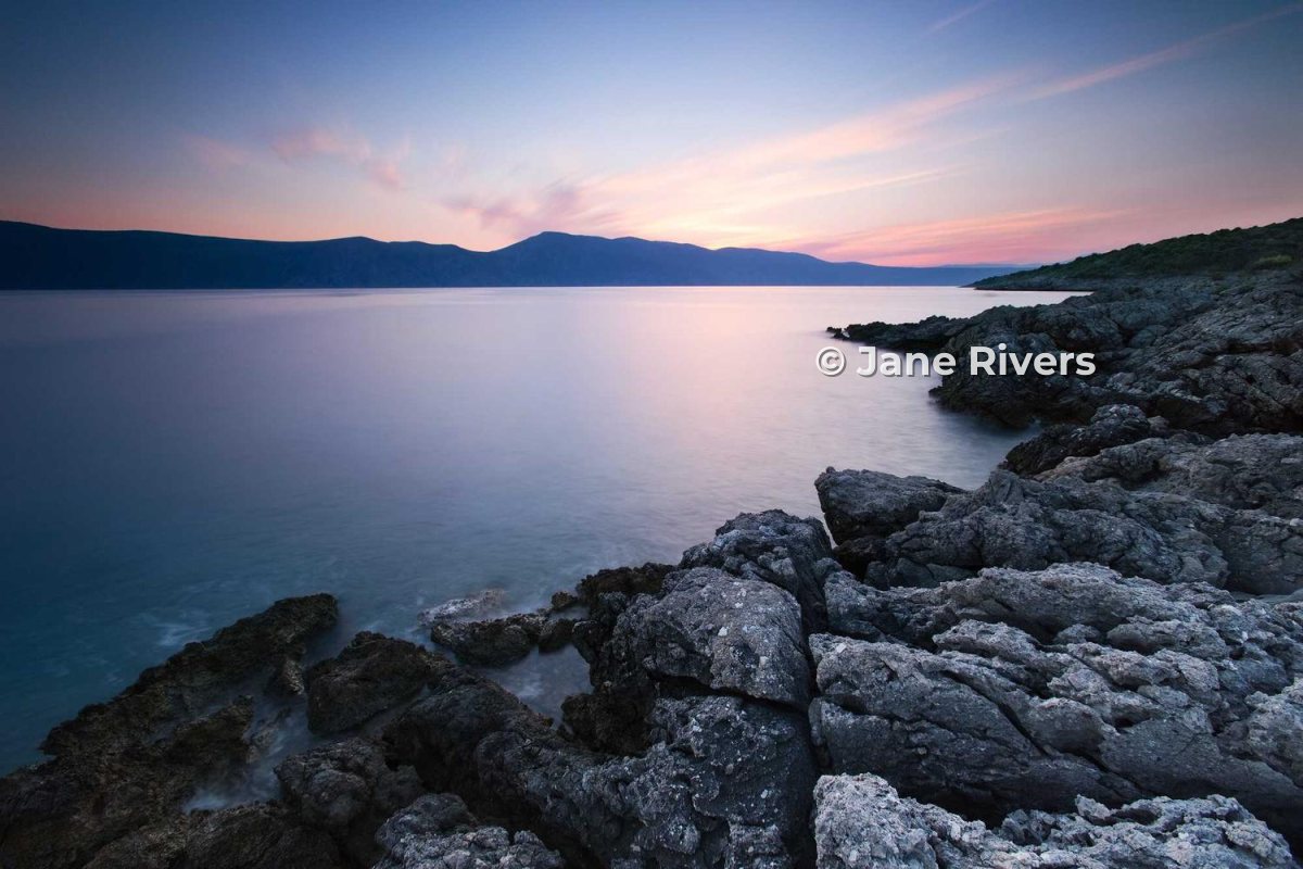 The same coastline photo with a small © Jane Rivers credit, for sharing online