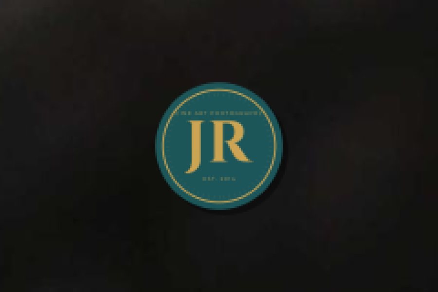 A close-up of a small logo whose tiny tagline text has blurred into unreadable specks