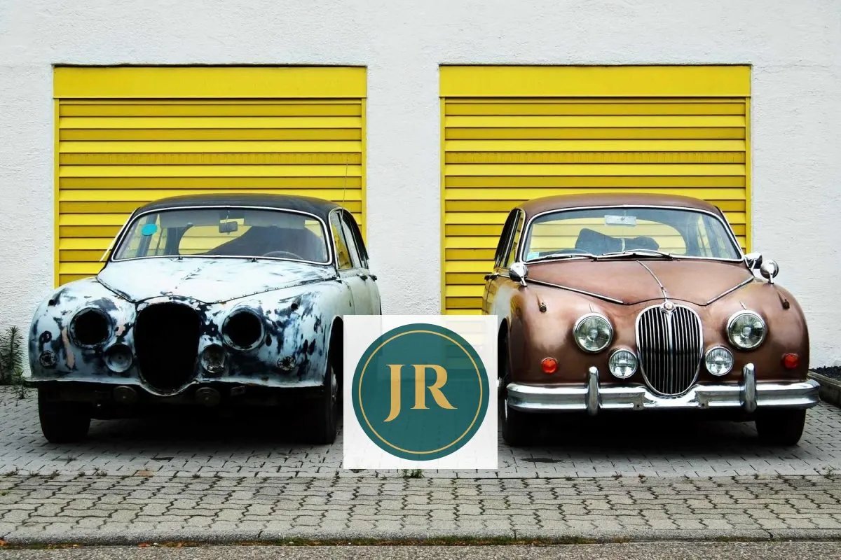 Two classic cars in front of yellow garage doors with a logo on a white square between them