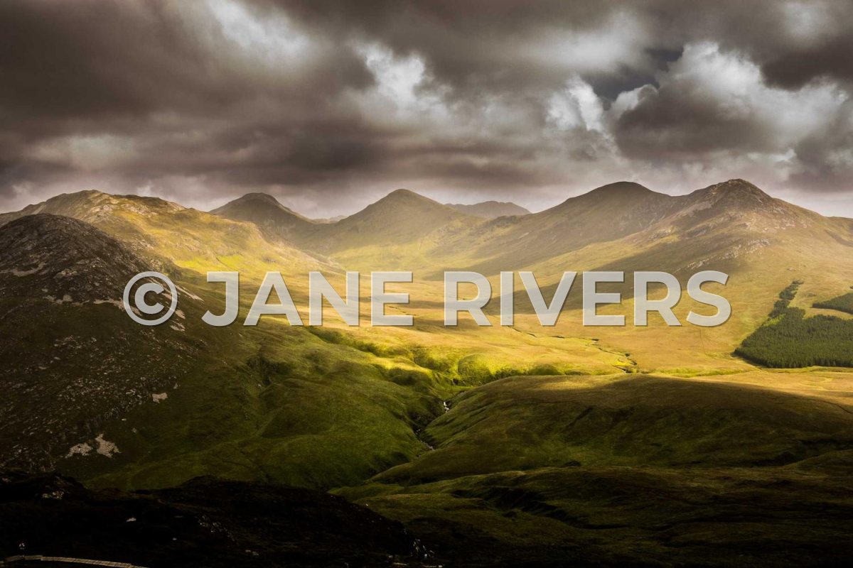 The same valley photo with a large semi-transparent © JANE RIVERS across the middle