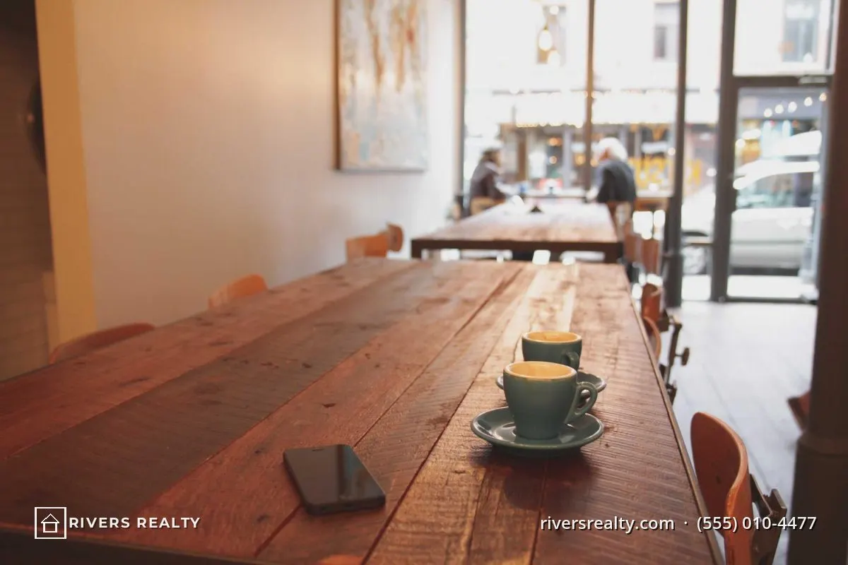 The same room with a small agency logo in the lower left and a website and phone number in the lower right