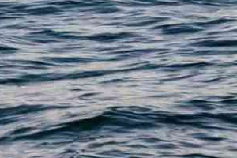 Enlarged crop of water saved at JPEG quality 30, with visible blocky compression