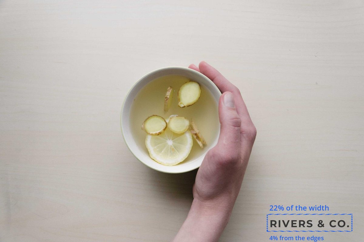 A product photo of a cup of tea with the shop mark in the bottom-right corner and guides showing it is 22 percent of the width and 4 percent from the edges