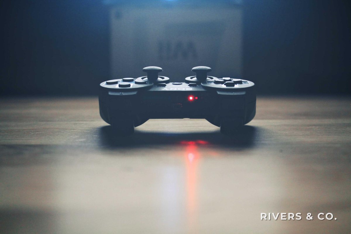 A landscape photo of a game controller with the shop mark in the bottom-right corner