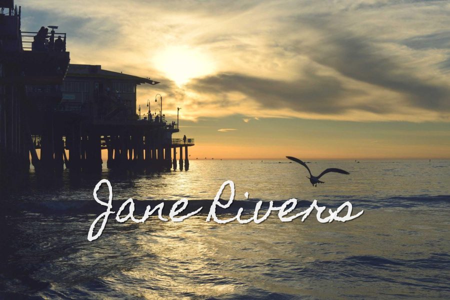 Jane Rivers in Homemade Apple, a casual handwritten font, over a pier at sunset