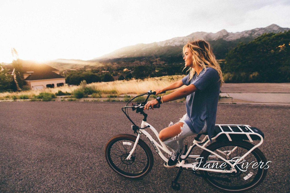 The same photo with the signature larger, beside the bike wheel, and easy to read