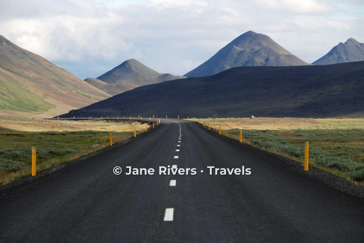 The same mountain road with the watermark placed on the road in the lower part of the frame