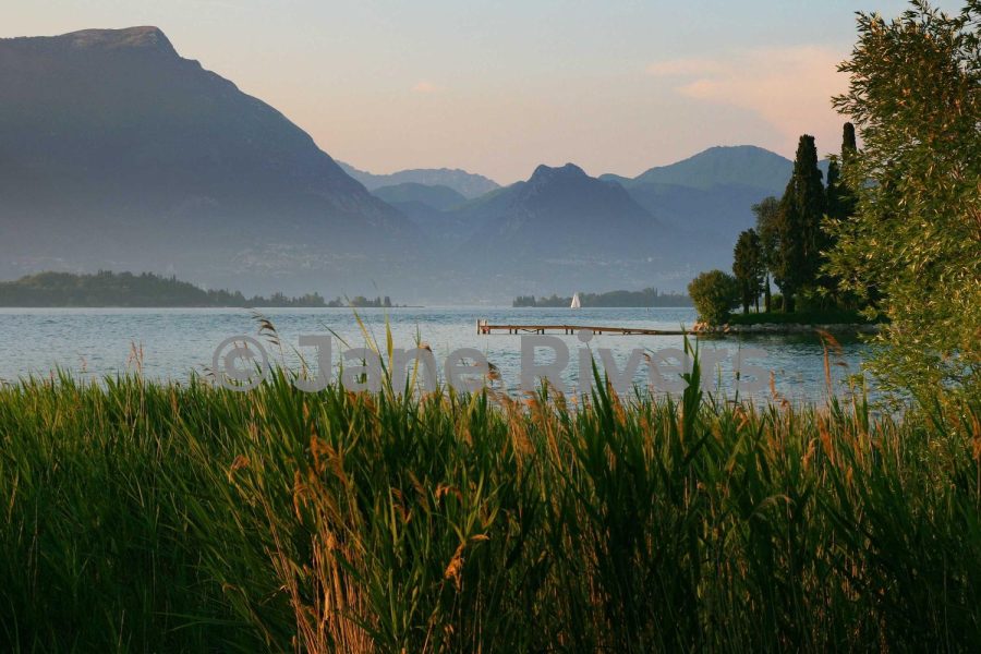 The same lake photo with a mid-gray watermark that blends into the scene