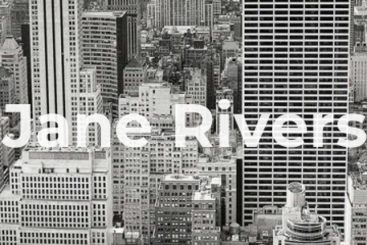 A close-up of a bold sans-serif watermark covering solid blocks of the city buildings