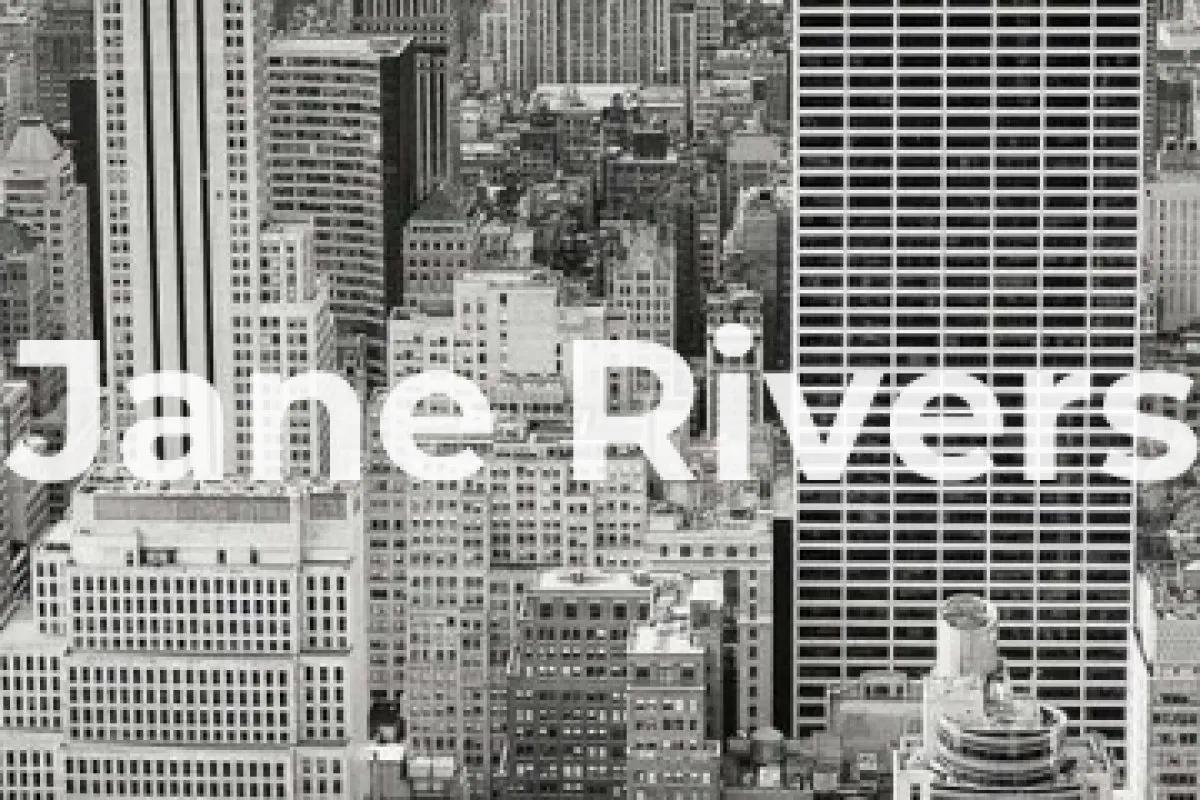 A close-up of a bold sans-serif watermark covering solid blocks of the city buildings