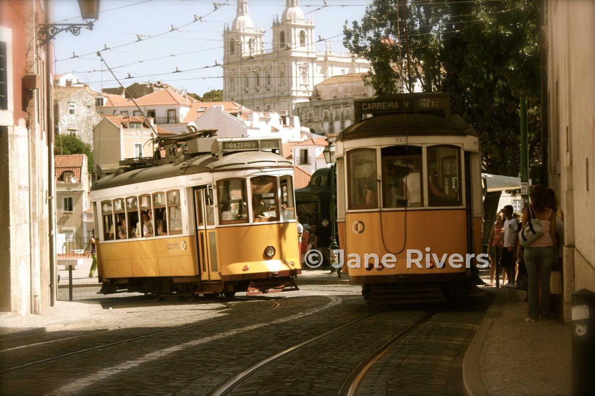 The same trams with a larger, semi-transparent watermark across the front tram