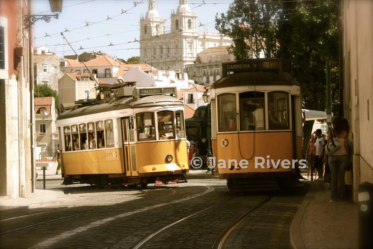 The same trams with a larger, semi-transparent watermark across the front tram