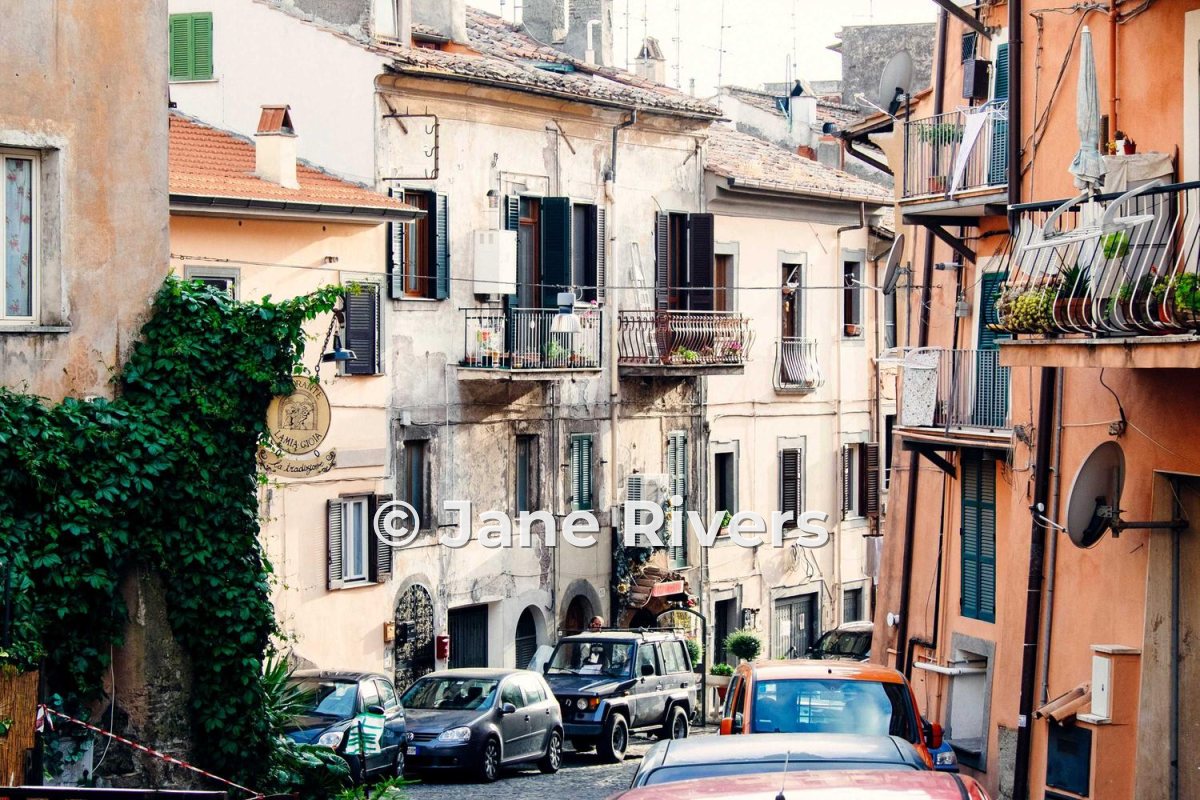 The same street with a bold sans-serif watermark with a soft shadow that reads clearly