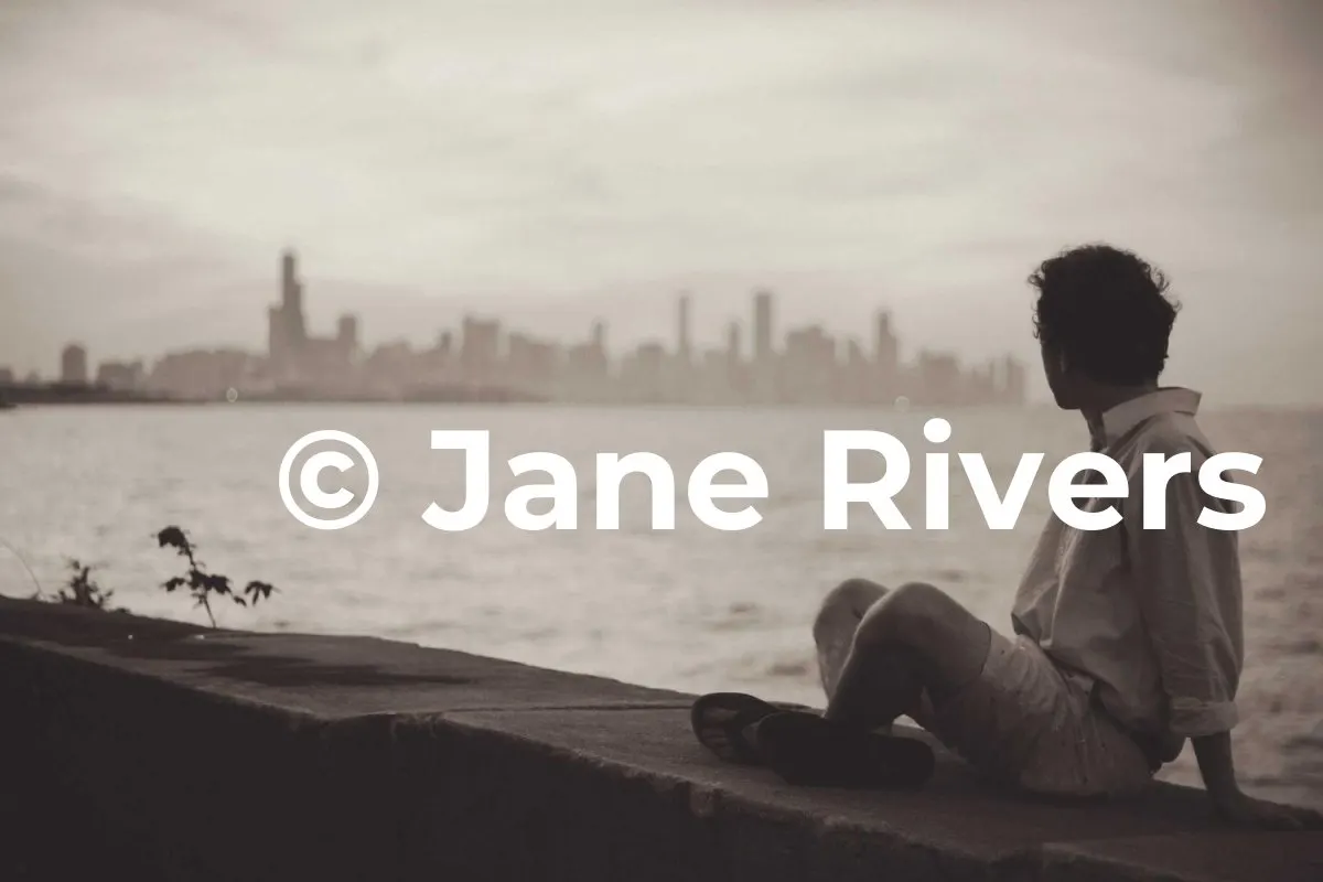 A person sitting by the water looking at a city skyline, with a huge solid white watermark across them
