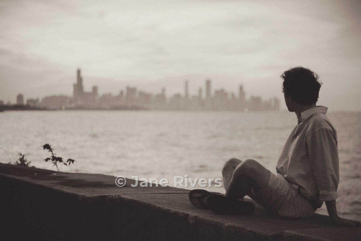 The same photo with a moderate, semi-transparent watermark on the wall beside the person