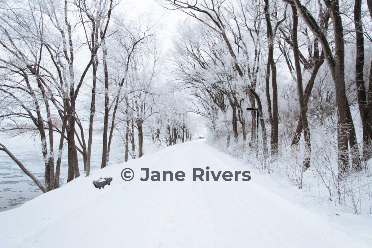 The same snowy path with a dark gray watermark that is clearly visible