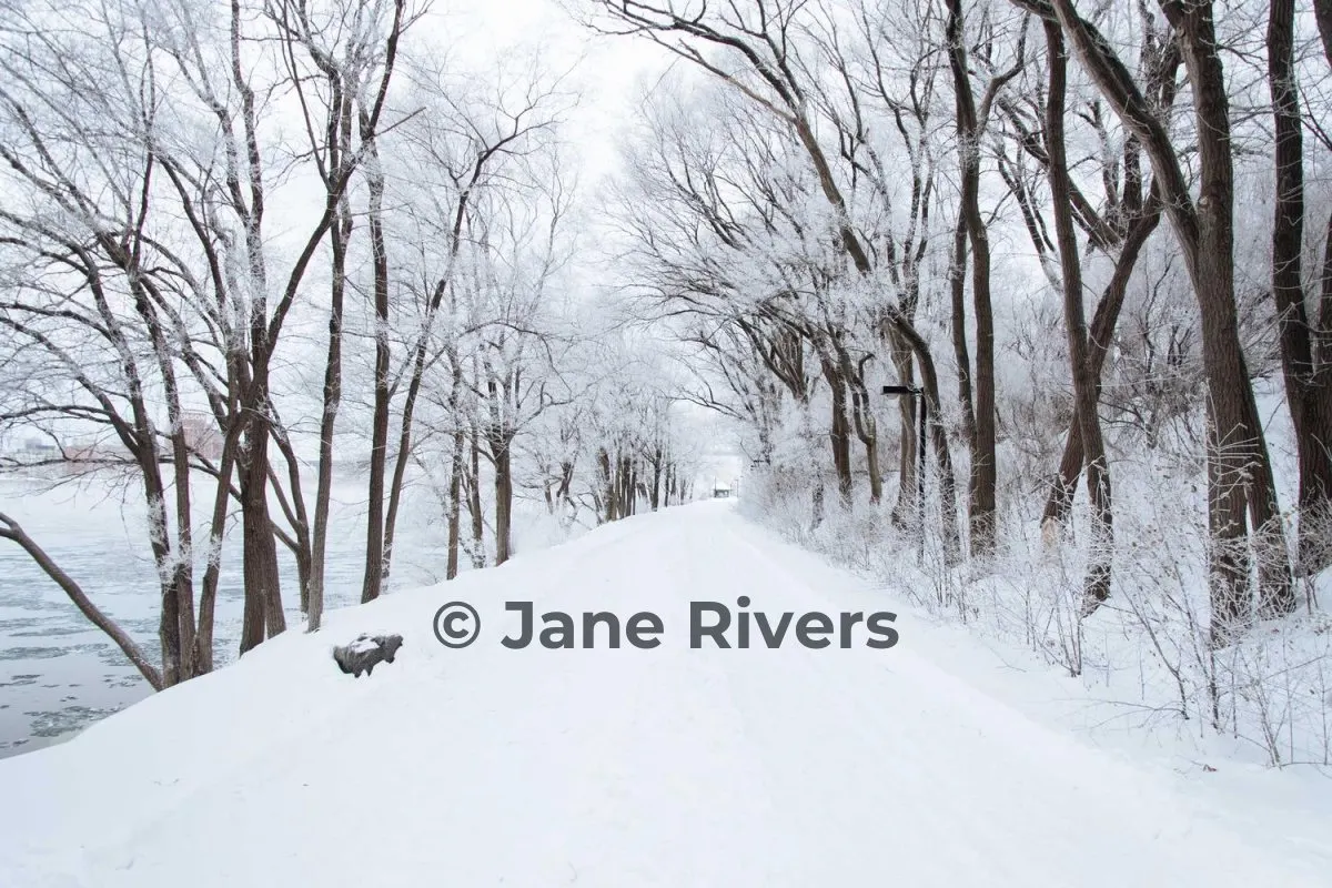 The same snowy path with a dark gray watermark that is clearly visible