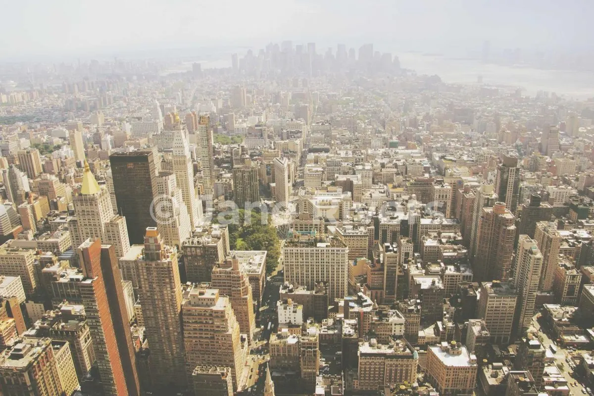 An aerial city photo with a 35% white watermark that blends into the buildings