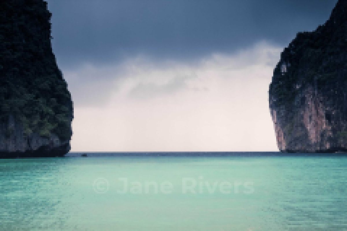 A beach photo shrunk to thumbnail size with a 15% watermark that has faded into the water