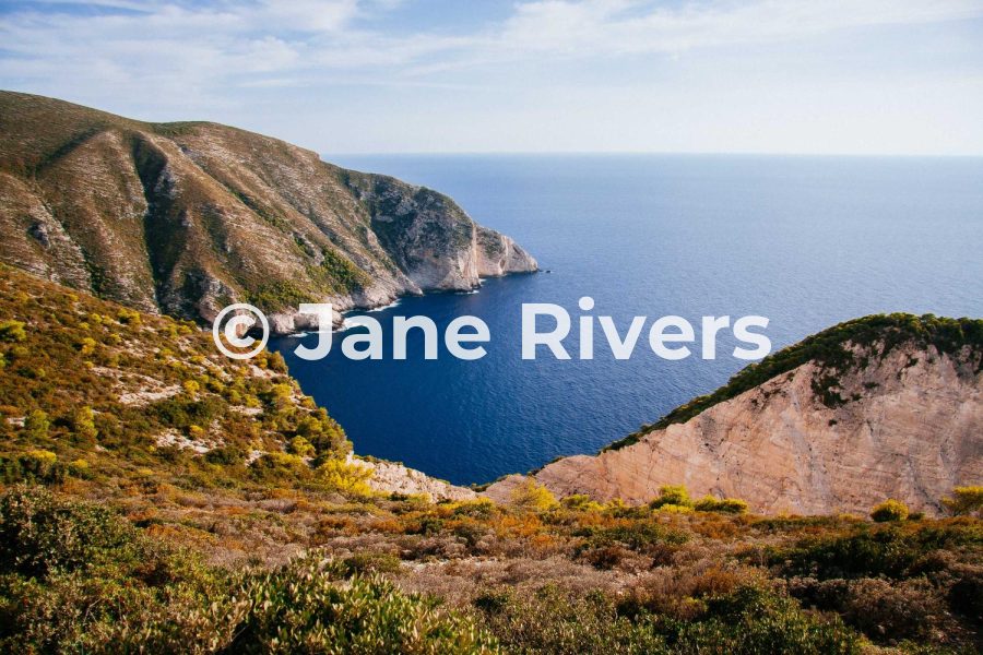 The same coastal photo with the watermark at 80% opacity