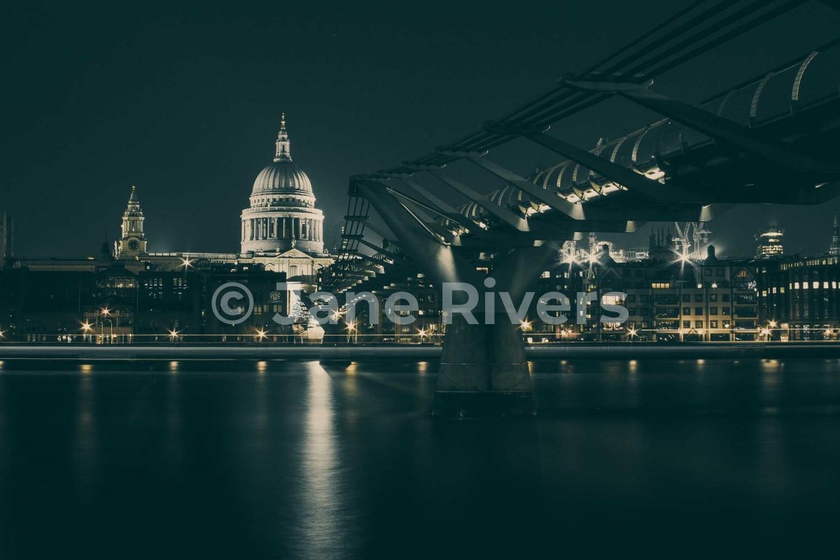 A night photo of a city skyline with a white watermark at 35% opacity that stands out clearly