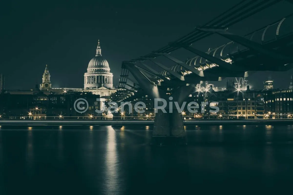 A night photo of a city skyline with a white watermark at 35% opacity that stands out clearly