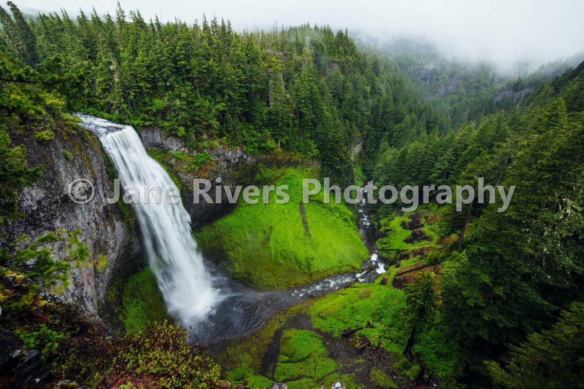 A waterfall photo with a large semi-transparent watermark in the center