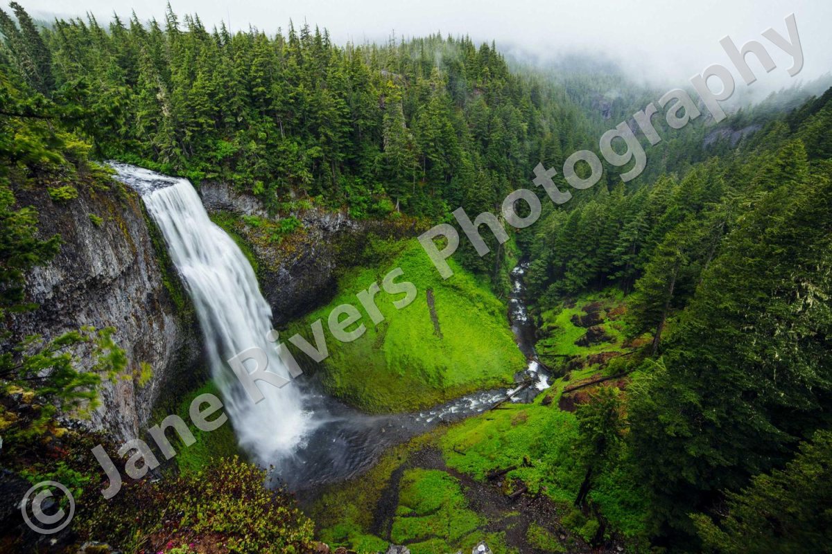 A waterfall photo with a large diagonal copyright watermark across the middle