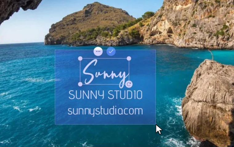 A selection box being dragged over three watermarks on a photo of a sea arch, the signature already selected with its handles showing